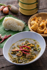 Thailand northern style chinese cabbage soup with pork rind and sticky rice.