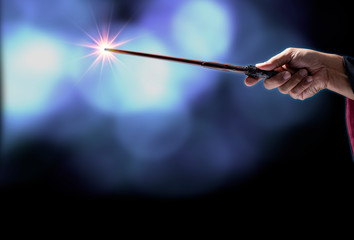 Magic wand with sparkle on miracle background, Miracle magical stick Wizard tool on hot background.