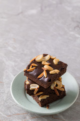 Chocolate brownie cake sprinkle with almonds and cashews.