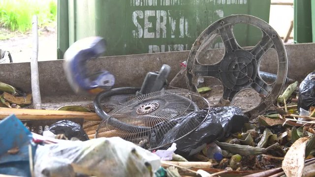 close-up. shovel rowing garbage. organics and plastic. waste treatment. gloved hands. waste fruits and vegetables. cleaning. sorting. waste recycling.
separate plastic from organics. cellophane
