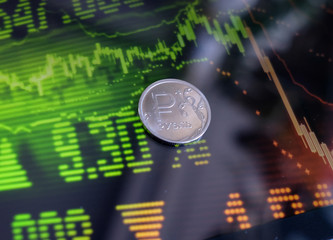 Russian ruble against the background of world stock quotes close-up