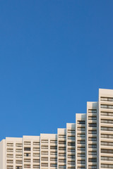 Minimal building with clean blue sky