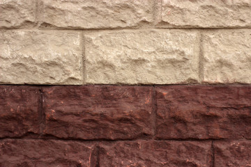 Old gray-brown brick wall with plaster, background, texture