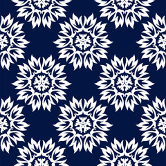 Floral seamless background. White design on dark blue backdrop