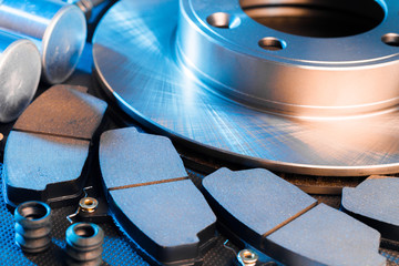 brake parts on dark background  brake pads, disc, brake hose, guides, cylinders - Image