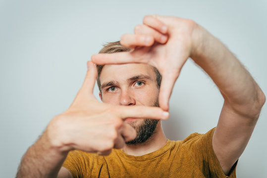 man making frame hand