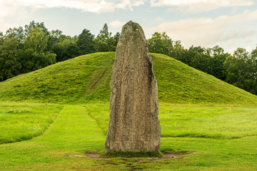 Close up of a large rune stone at an ancient burial ground