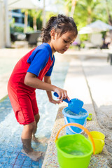 Kids playing with beach sand with they toys