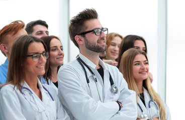 large group of doctors congratulating each other with applause