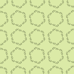 Seamless pattern with fascinating cozy green branches on light green background.  Vector image.