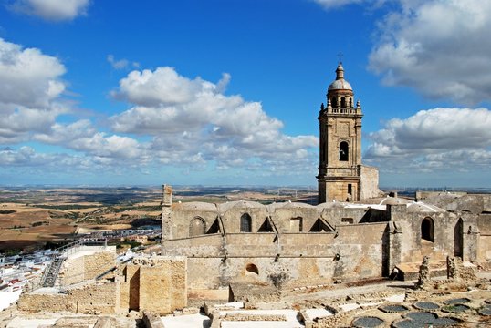 Medieval town wall and Santa Maria church bell tower, Medina Sidonia, Spain.