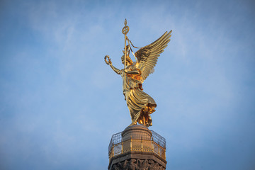 Closeup of  Berlin Center Siegessäule, Statue in golden Morning light 
