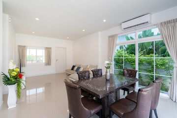 Top granite dining table with dining chairs in spacious room in villa, house and apartment
