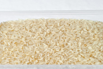 Texture of white polished rice. Lots of rice on the pile.