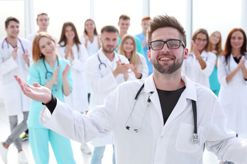 Obraz na płótnie Canvas in full growth. young medical doctors standing ovation
