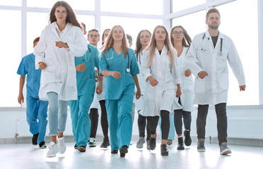 group of hilarious doctor interns showing thumbs up