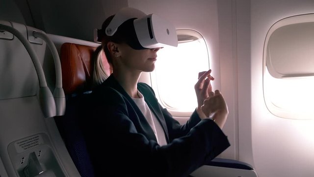 Caucasian female boss using interaction technology for creating business web platform in cyberspace connected to hotspot on board, skilled woman networking realistic simulation via VR projection