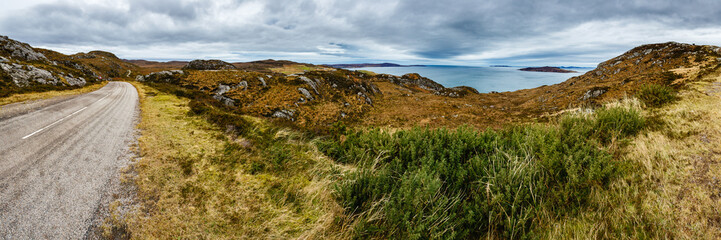 Panoramic view of a road between the hills in Scotland