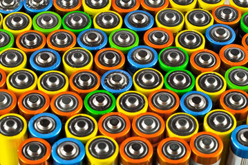 Many used batteries from different manufacturers. Old batteries for recycling.