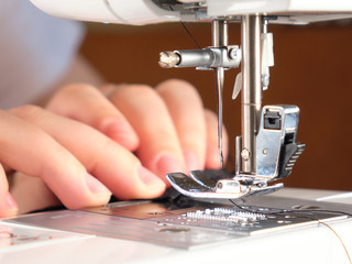 Needle for sewing machine in motion. The close-up of the sewing machine needle quickly moves up and down.