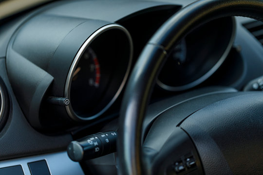 Close up view of the interior of a modern automobile showing the dashboard.