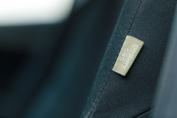 Car seat side airbag label on luxury leather - increased safety in a car - health protection