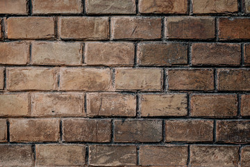 background of old authentic brick wall at Chernivtsi University. Handmade brick textured unique colors, the work of true craftsmen