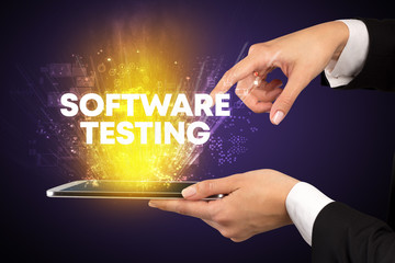 Close-up of a touchscreen with SOFTWARE TESTING inscription, innovative technology concept