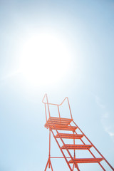 Career ladder to the sky. Red ladder leads to the sky. Space for text.