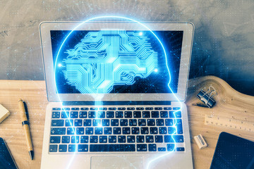 Multi exposure of work space with computer and human brain hologram. Brainstorm concept.