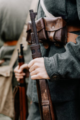 13.10.2019 Vinnitsa, Ukraine: military actors hold weapons of World War II, original guns and pistols. Military reconstruction of guerrilla fighting in Ukraine