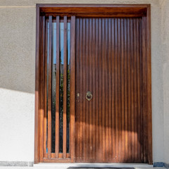 house entrance natural wood and glass door