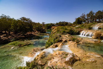 Fototapeta na wymiar River Waterfall and pond in Wadi Darbat near Salalah
