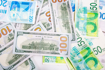Israeli and American banknotes. Shekel and American dollars.