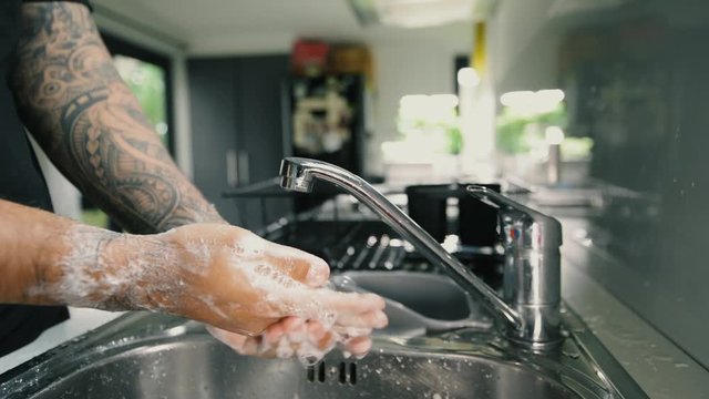 A man washing his hands with foam hand wahs for corona virus prevention, hygiene to stop spreading coronavirus.