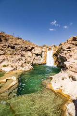 Fototapeta na wymiar River Waterfall and pond in Wadi Darbat near Salalah