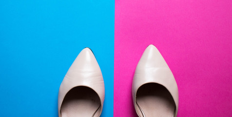 Pointy shoes on colorful pink and blue background. free copy space. Overhead shot of summer elegant shoes. Top view, flat lay
