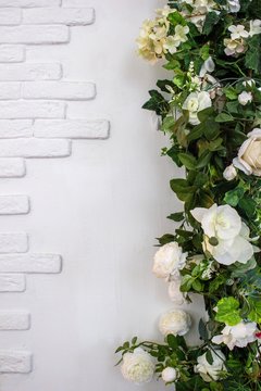 Beautiful Decorative White Flowers On Brick Wall