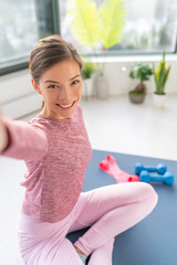 Selfie phone photo Asian influencer girl live streaming home workout giving fitness class online...