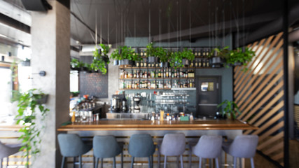 Bar counter with soft chairs in cafe with no visitors