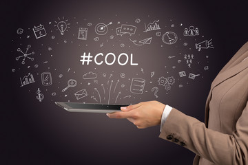 Fototapeta premium Close-up of a touchscreen with #COOL inscription, social media concept