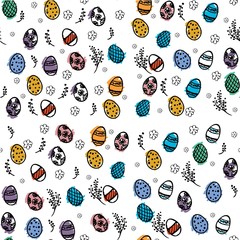 An Easter pattern made of easter eggs and flowers