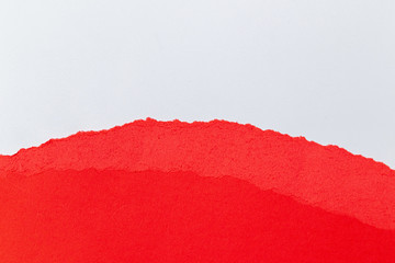 Red torn paper with white copy space.