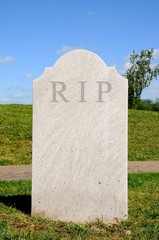 Plain grey textured tombstone with the letters RIP.