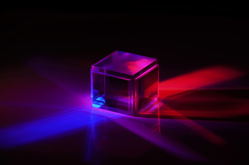 a crystal cube reflects colored rays