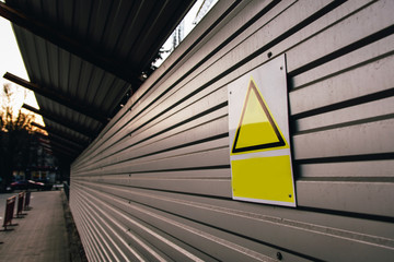 dangerous work in progress, entry prohibited. yellow sign on the fence