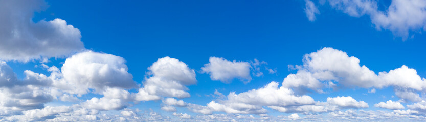 Fototapeta na wymiar Panoramic fluffy cloud in the blue sky. Sky with cloud on a sunny day.