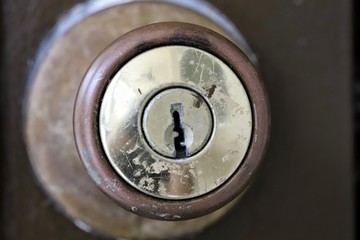 Closeup of weathered door lock with keyhole