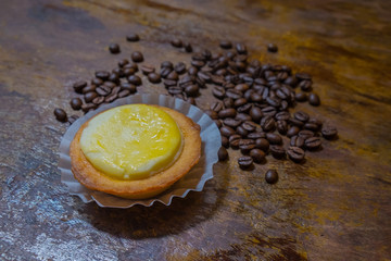 Bake Cheese Tart dessert on coffee bean.