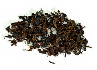 Dry tea leaves on a white background